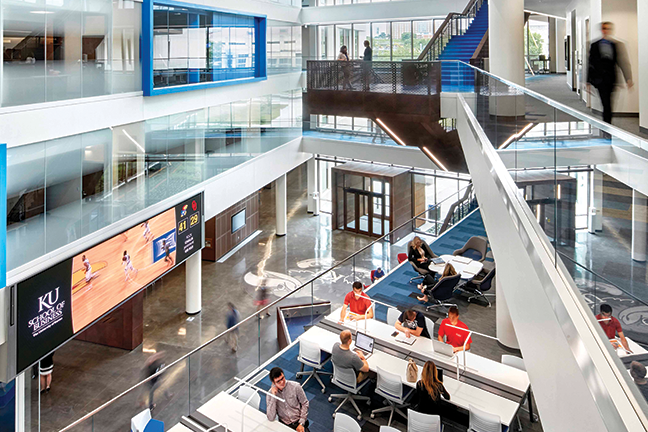 Impact on entry—The atrium of Capitol Federal Hall, opened in 2016 as The University of Kansas’ business school facility, features a video wall completed just in time for the ribbon-cutting.