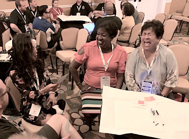 UBTech attendees participate in a role-playing exercise as a classroom improvement committee designing active-learning spaces.