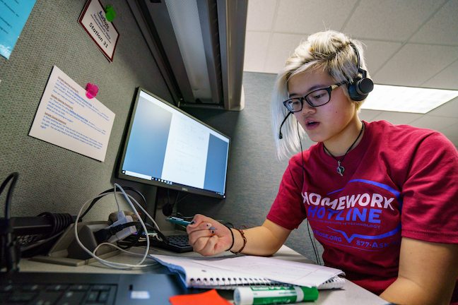A Rose-Hulman Institute of Technology student tutor provides homework help to a high school caller. The university's AskRose program makes college tutors in math and science available Sunday through Thursday nights.
