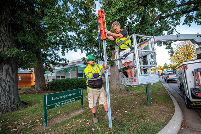 On solid ground—Michigan State University’s landscape and grounds team is responsible for maintaining 1,500 acres of green space, 57 miles of roadways and 22,000 trees. Among the department’s many services is the installation of roadway and wayfinding signage.