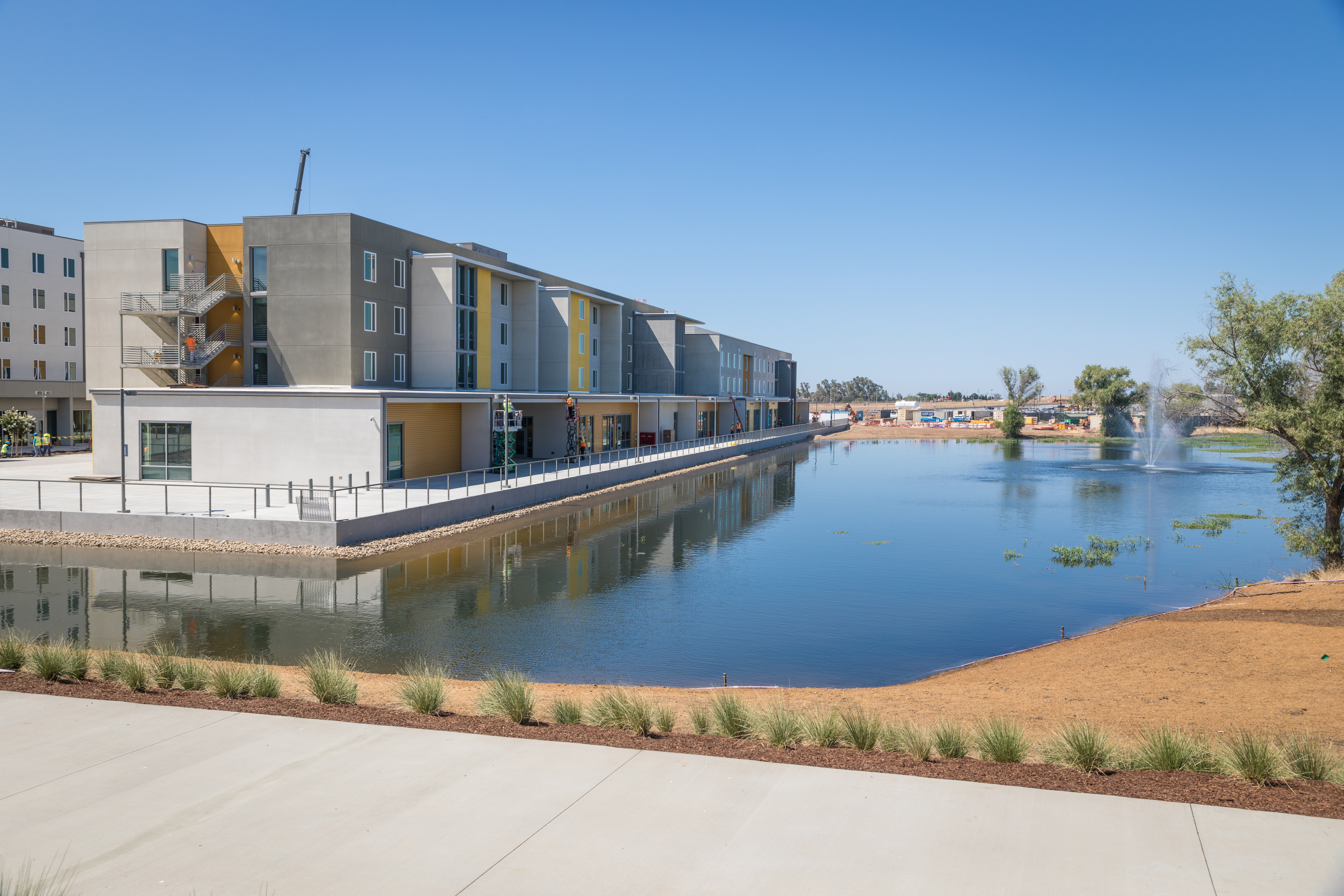 LONG-TERM PARTNERS—Building through public-private partnerships helps institutions such as University of California Merced to grow. The Merced 2020 expansion involves a 39-year agreement with a single private development team from Plentary Properties Merced. Granite Pass Residence Hall is one part of the plan; a two-phase project; its northern phase was completed in 2018 and its southern portion is scheduled for opening in 2020.