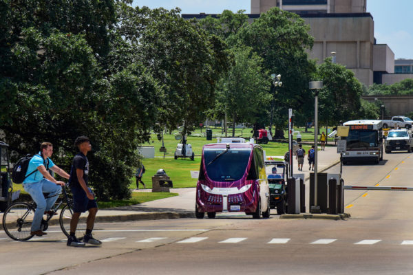 Texas A&M has tested self-driving shuttles (pictured) on a fixed course amid routine pedestrian and cycling traffic as part of its initiatives to create a more connected and walkable campus.