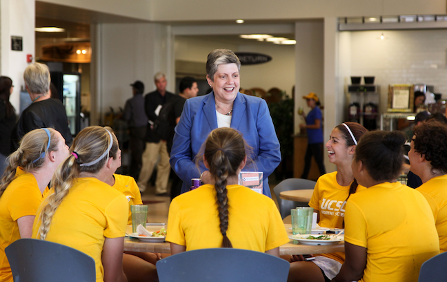 University of California President Janet Napolitano, shown here with the University of California, Santa Cruz women's soccer team, wants the system to drop SAT and ACT scores as admissions requirements.