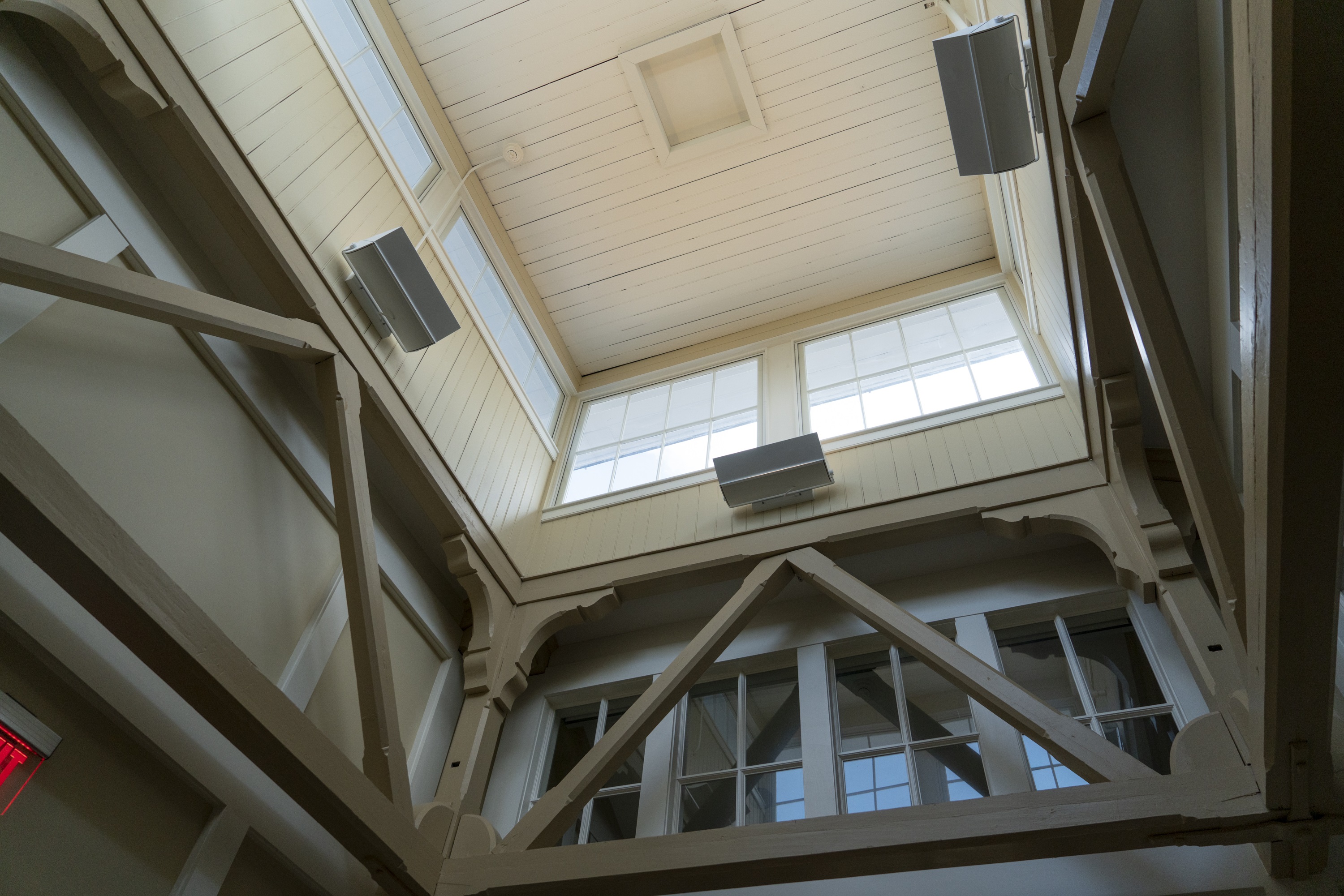 A site investigation at Washington and Lee University’s Newcomb Hall revealed trusses and a light well hidden beneath the building’s cupola. They had been covered by ductwork and dropped ceilings. The renovation design incorporated the features, adding natural light and character to the building.