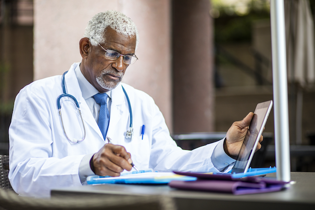 A university's chief health officer could ensure campuses have enough supplies of personal protective equipment and educate communities on responsible behavior that prevents the spread of COVID-19, among other initiatives. (GettyImages/adamkaz)