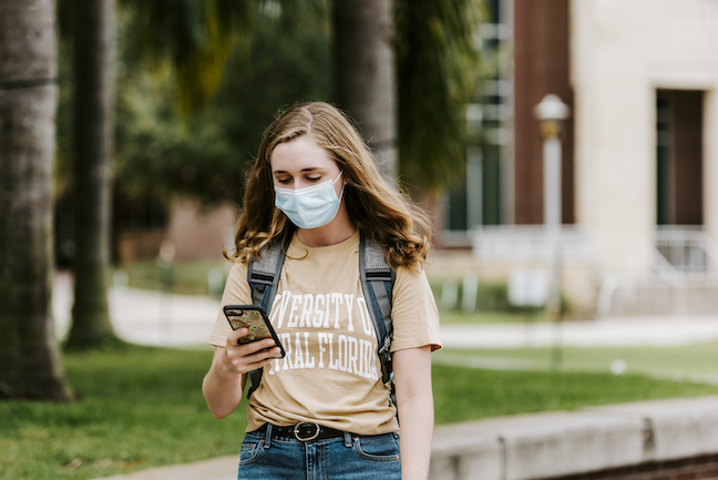 A student at the University of Central Florida self-assesses for COVID symptoms with the school's mobile app