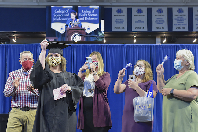 Organizers assigned each family to a taped-off box for social distancing at the at a recent the University of North Georgia's recent commencement ceremony for spring and summer graduates.