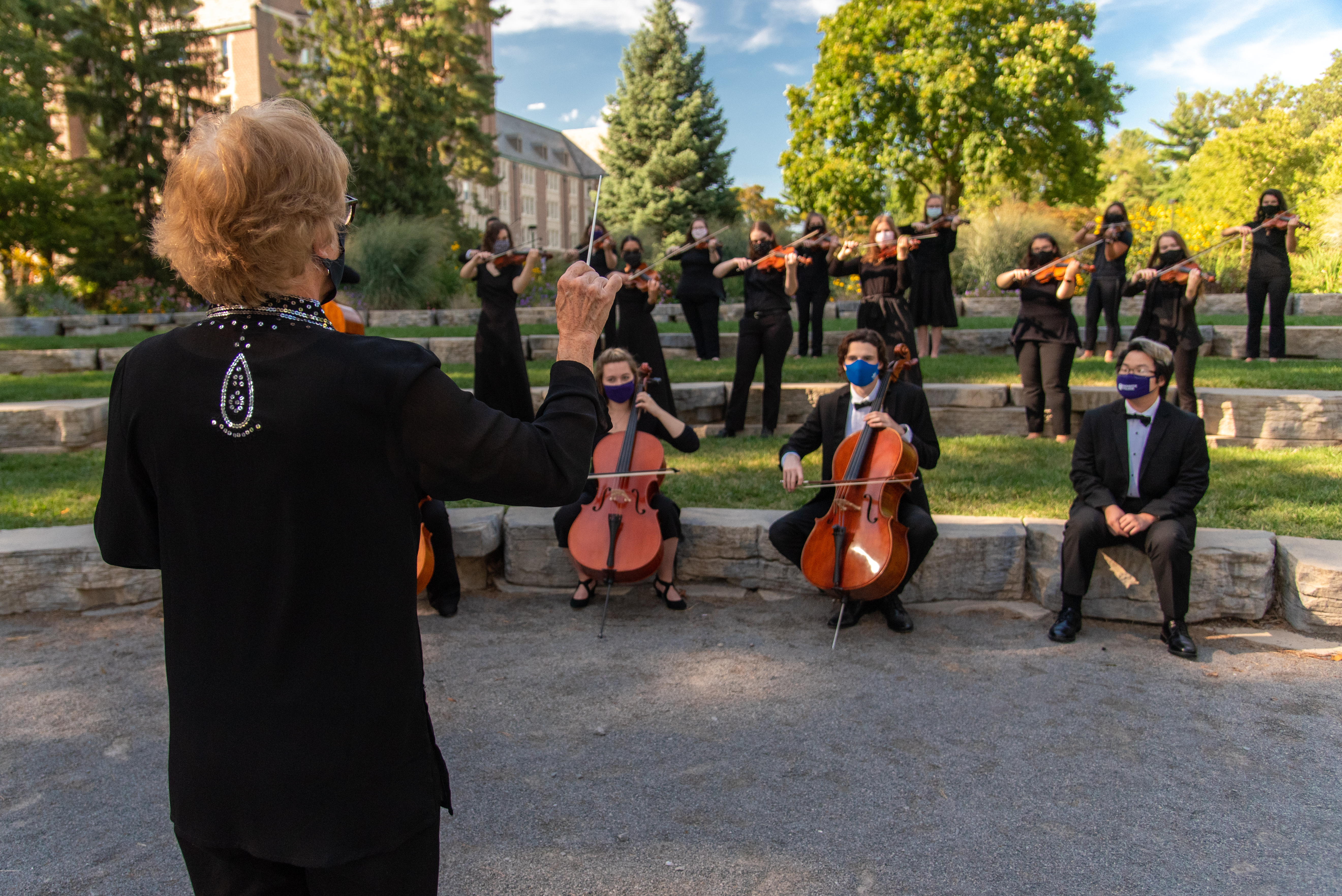 nancy at fountain with orchestra