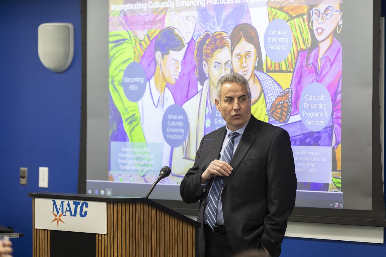 Mohammad Dakwar, Milwaukee Area Technical College's vice president of learning, speaks to campus employees about the school becoming a Hispanic-serving institution institution.