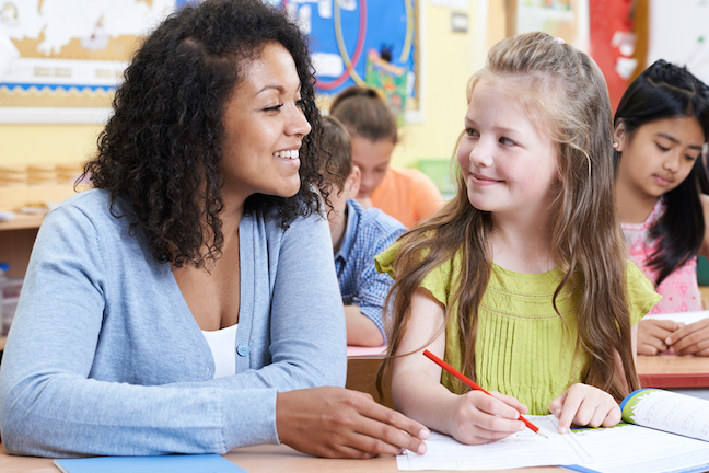 Students of all racial and ethnic backgrounds view teachers of color favorably, and students of color perform better when they have teachers of color, teacher prep experts say, (AdobeStock/highwaystarz)