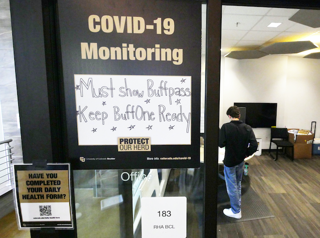 A student visits a COVID testing station at the University of Colorado Boulder.